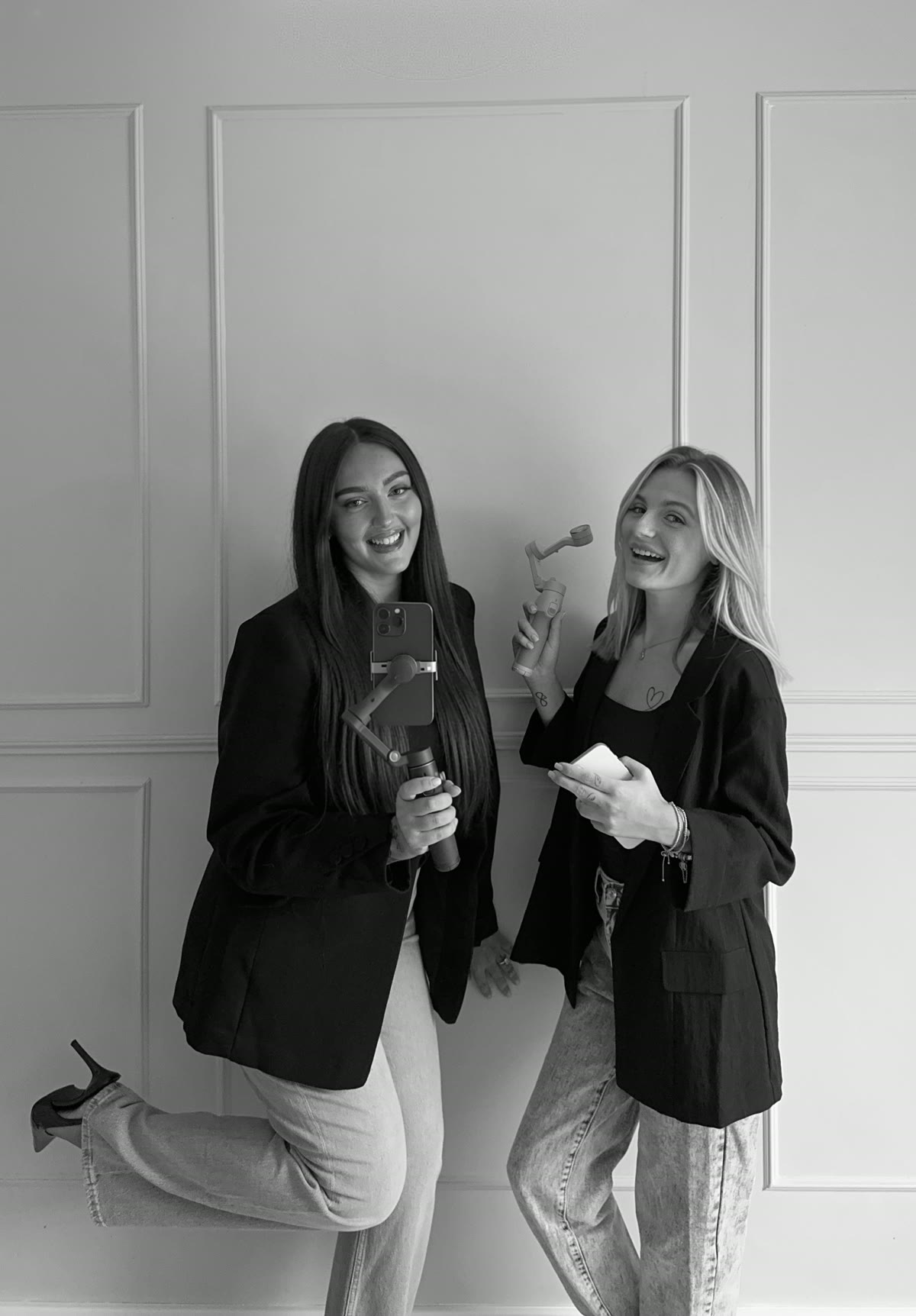 Lauren and Sasha, wedding content creators, filming with a phone and gimbal